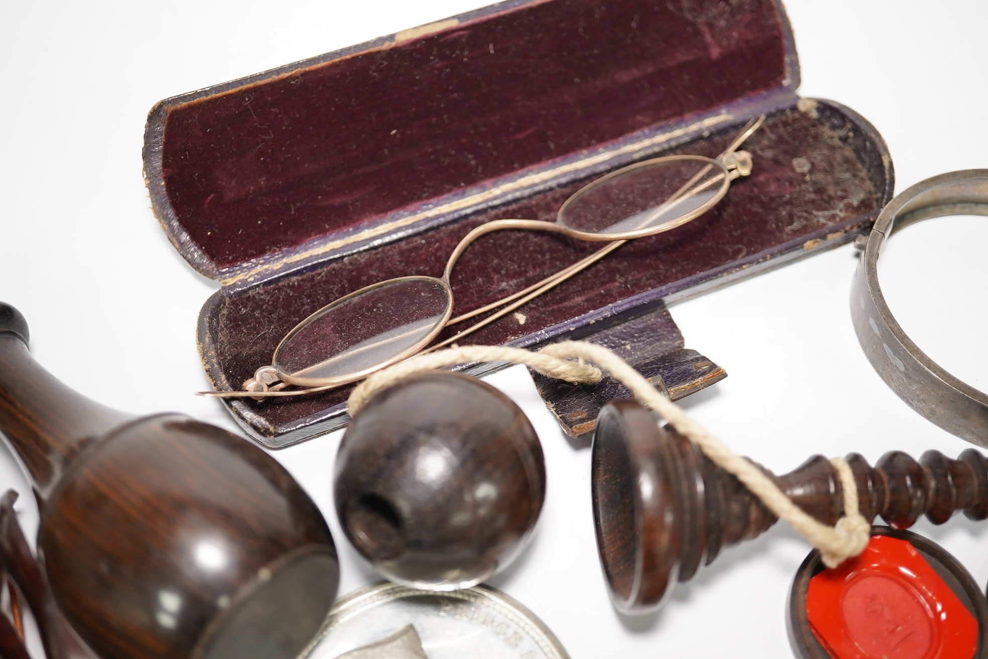 A group of various oddities to include a miser's purse, a lignum vitae ball and cup game, a mourning brooch, spectacles etc. Condition - varies
